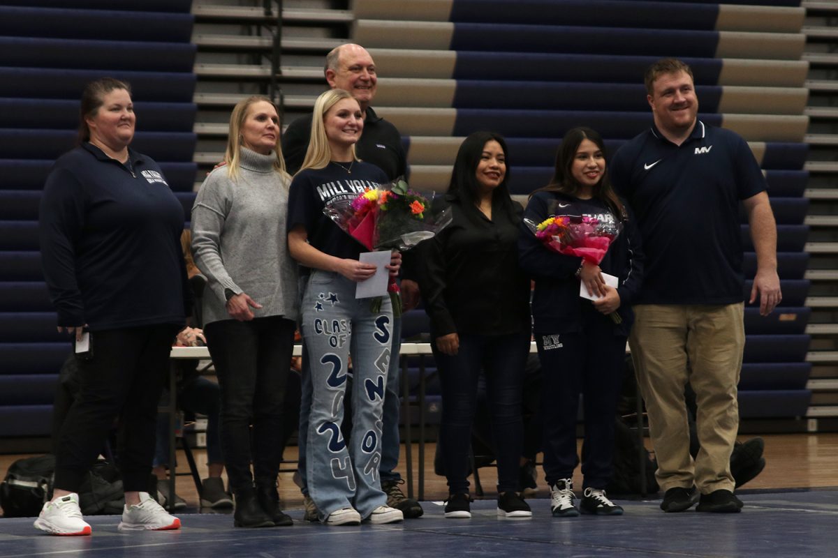 Seniors Emily Summa and Nathalie Gutierrez celebrate senior night at the girls wrestling meet.