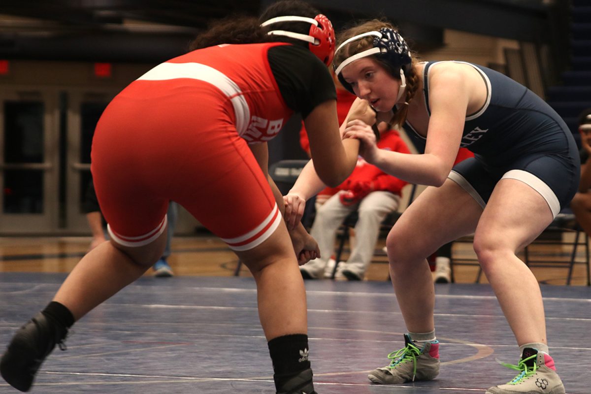 Planning her take down, Cadence Kerr  goes on to win her wrestling match.