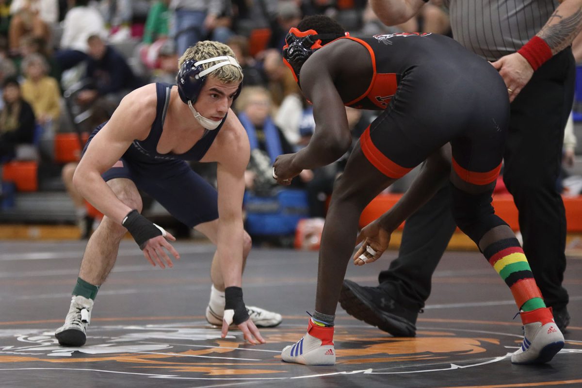 Eyes focused, senior Maddox Casella squares off against his opponent. 