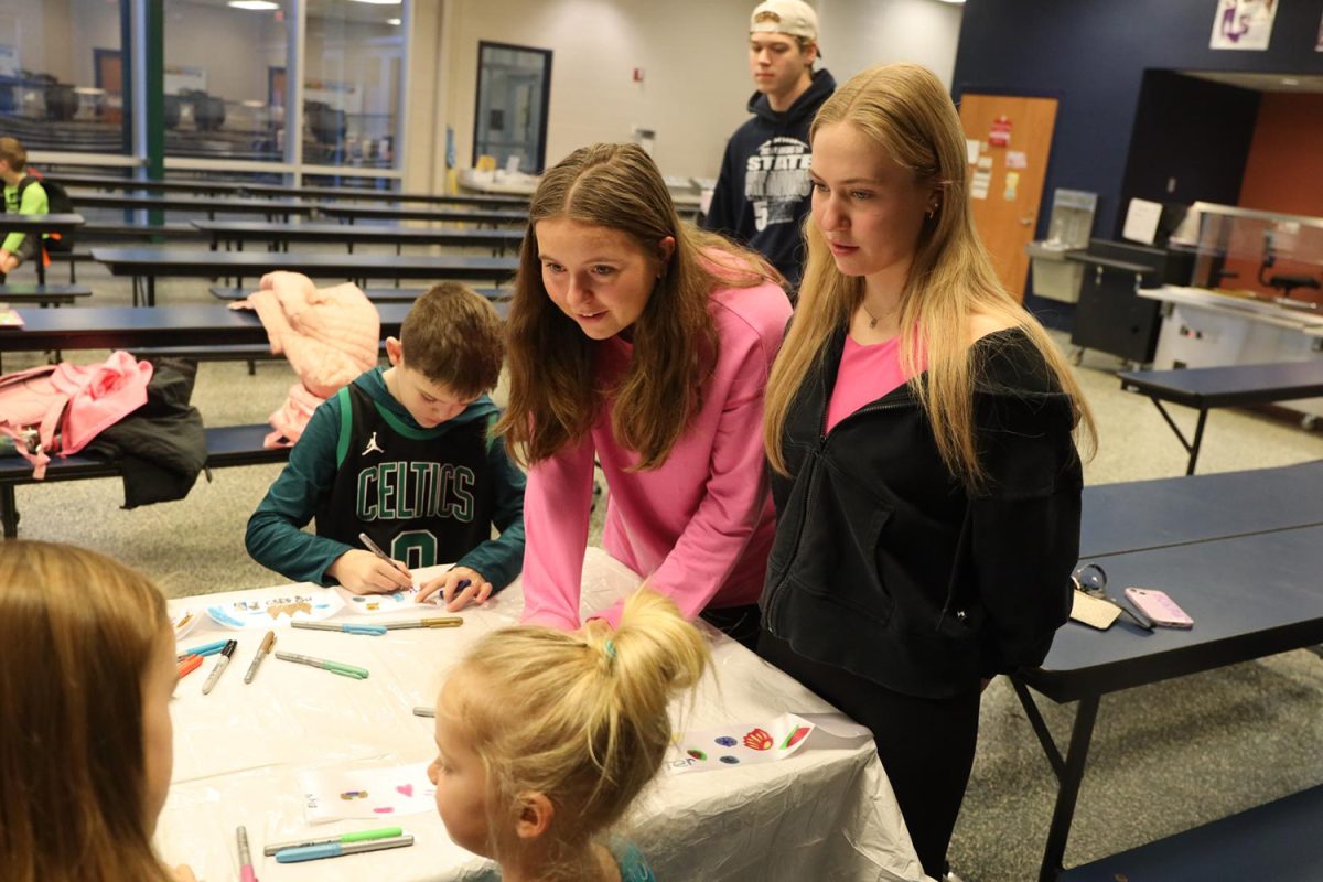 Helping students to pick out what to draw, seniors Elly VanRheen and Jaiden Fisher talk about what their favorite animals are Wednesday Jan. 31.