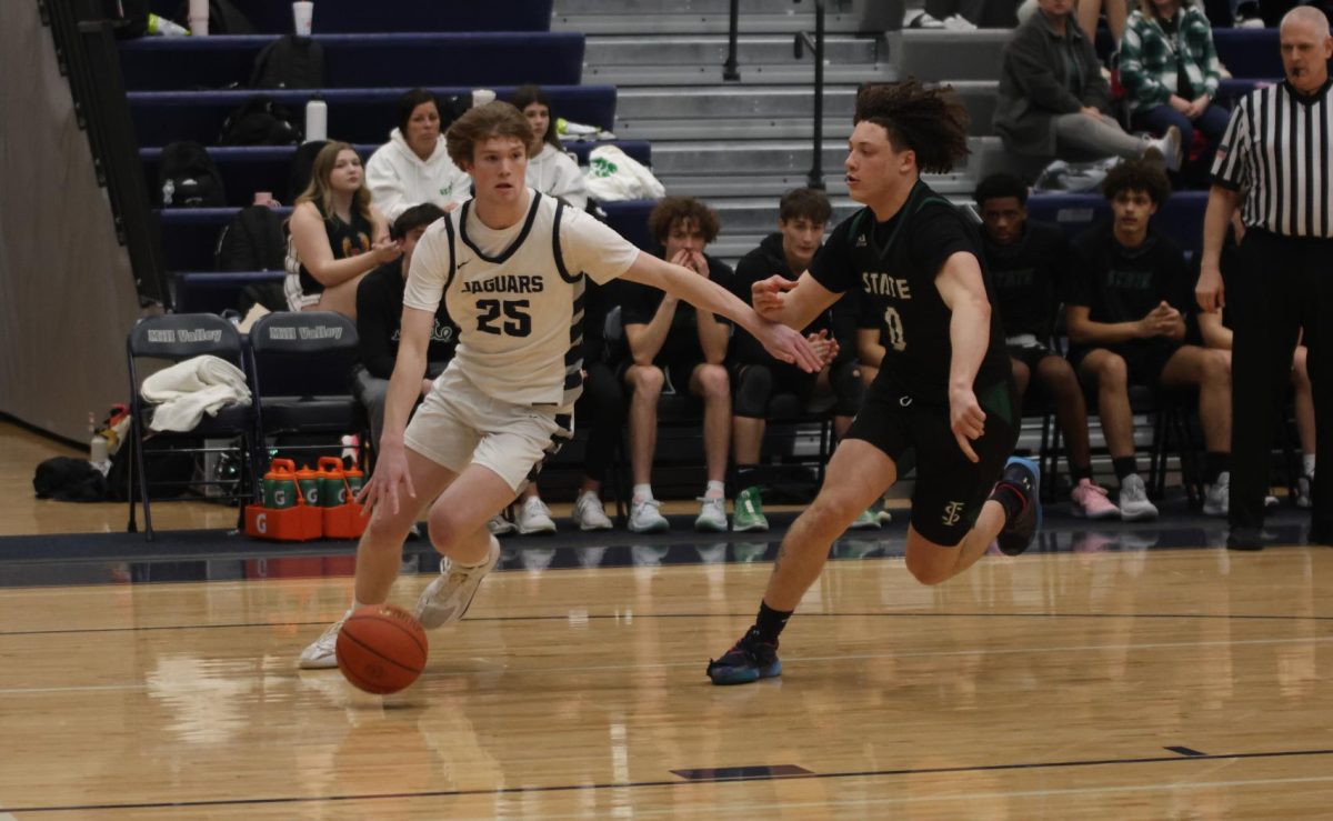 Junior Carter Kaifes dribbles around his opponent.