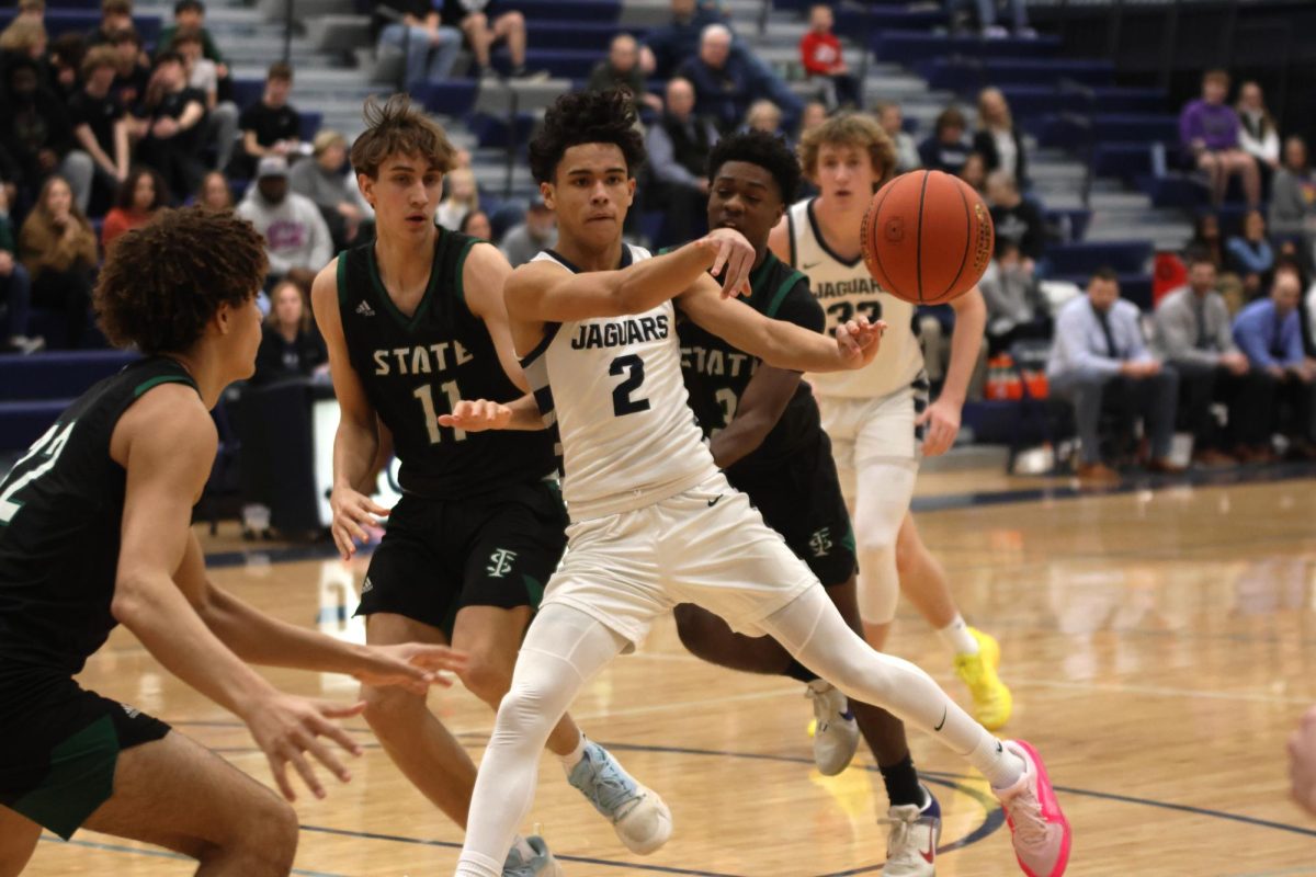 Sophomore JaKhai Carter passes the ball to a teammate.