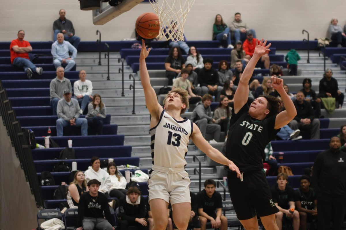 Senior Bryant Wiltse goes up for a lay up.