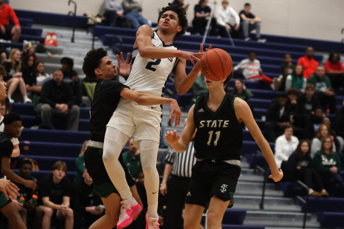 Going up for a shot, sophomore JaKhai Carter gets fouled.