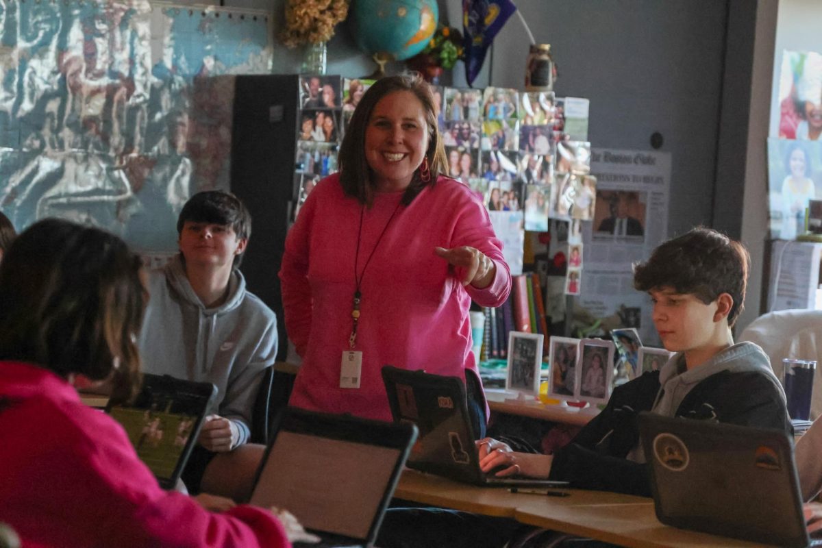 Explaining a political cartoon, history teacher Angie DalBello dives deep into the artists through process in class, Thursday, Feb. 1. For the 2024-2025 school year, DalBello will be teaching History of the Holocaust, one of the eight new classes to be offered next year.