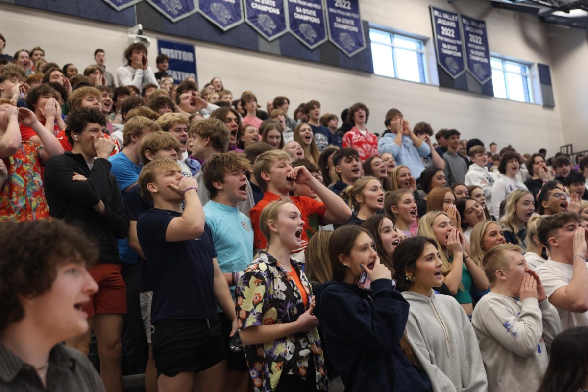 Yelling out, students participate in the “Hey, hey, whaddya say?” tradition.