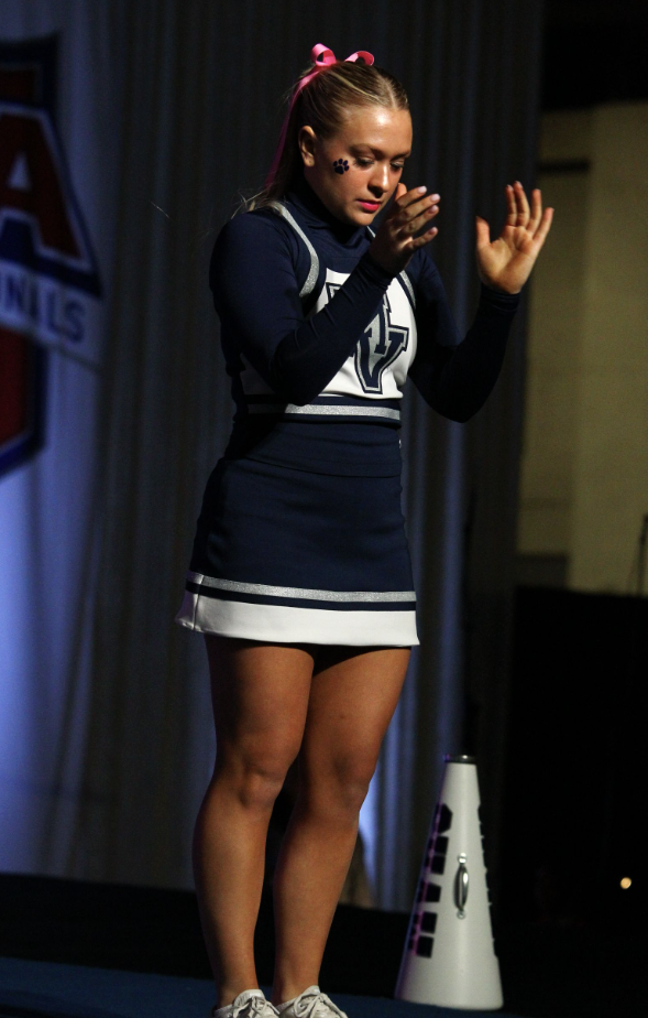 Clapping her hands, senior Danika Dulitz gets ready for the performance routine Saturday, Jan. 20.