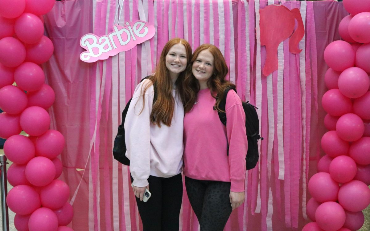With a smile on there faces, freshman Claire Bohon and Annie Bohon stand side by side for Barbie day Wednesday Jan. 31st