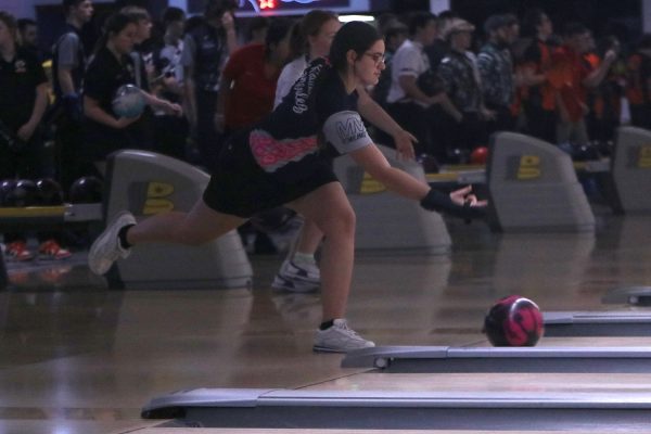 Focusing on the ball, senior Kiara Gonzalez tries to get a strike at the meet at Park Lanes Tuesday, Feb. 13. Gonzalez bowled a series of 588 earning her fourth at the meet.