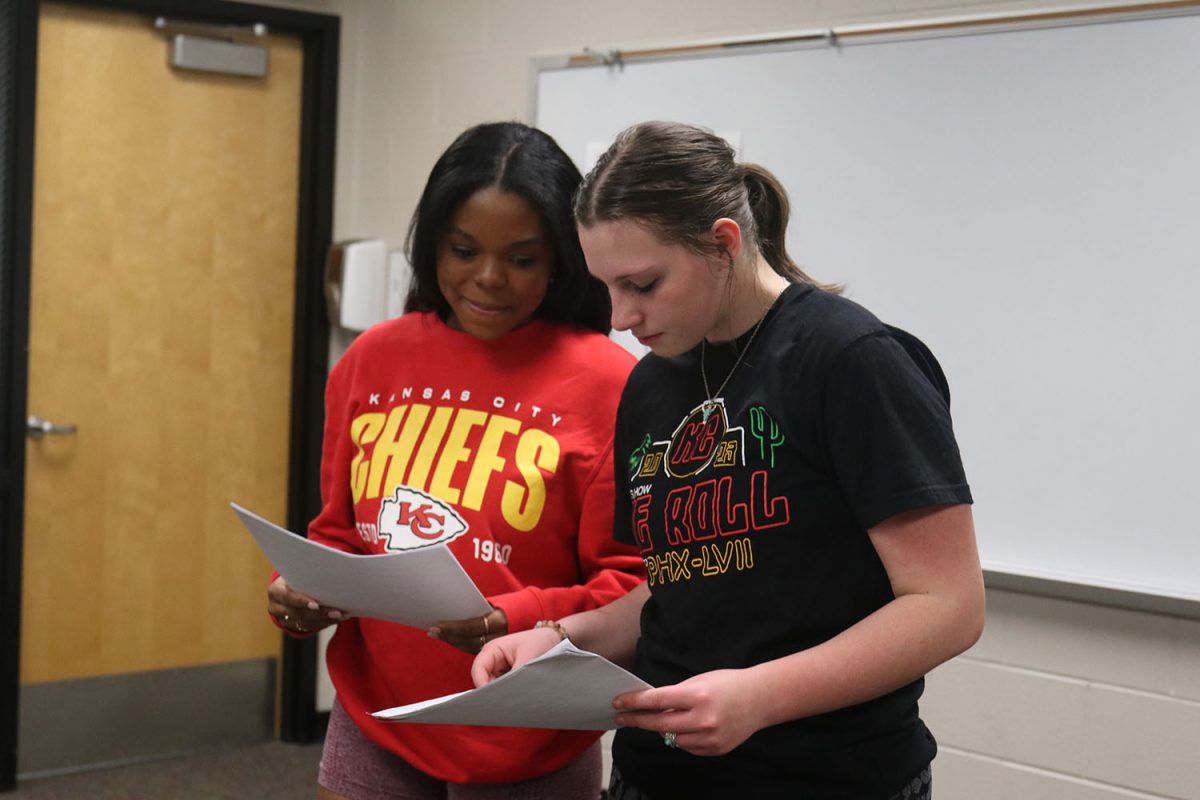 Reading through their script, sophomores Tristyn Jones and Lillian Gibson prepare for their performance.
