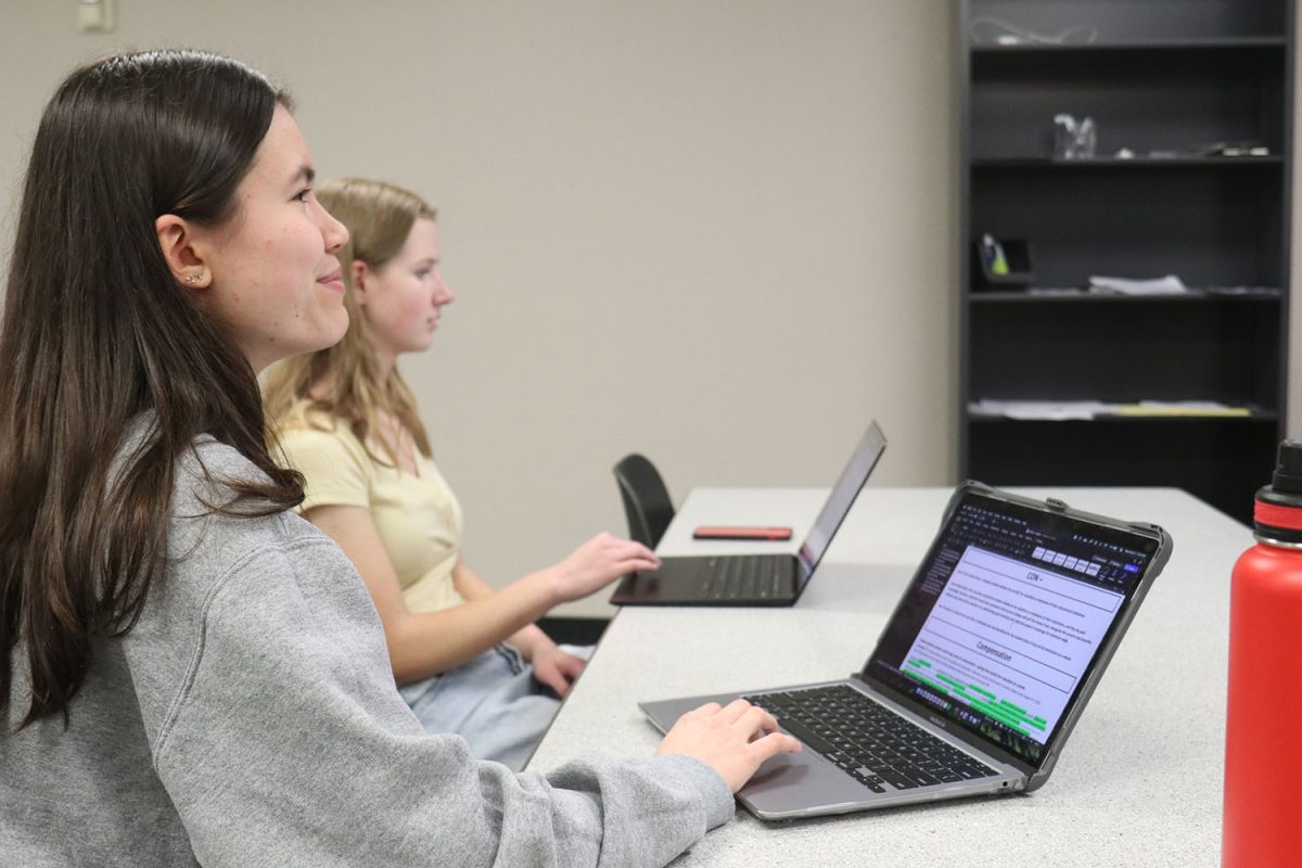 Laptops ready to go, junior Sophie Hsu and Sophomore Jordan Powell discuss their first contention regarding student athletes. 
