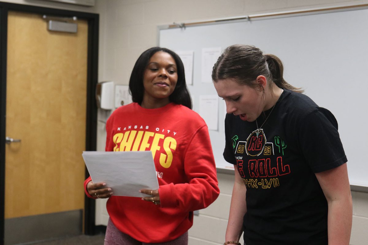 Getting into character, sophomores Tristyn Jones and Lillian Gibson work together to create a piece about two elderly women who swap memories via the cards their memories are stored on. 