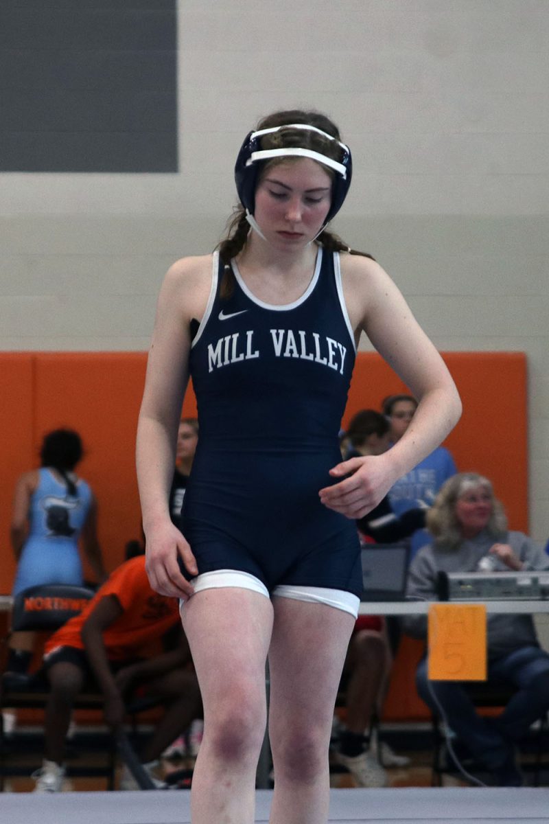 Taking a deep breath, junior Piper Wendler prepares for her match.
