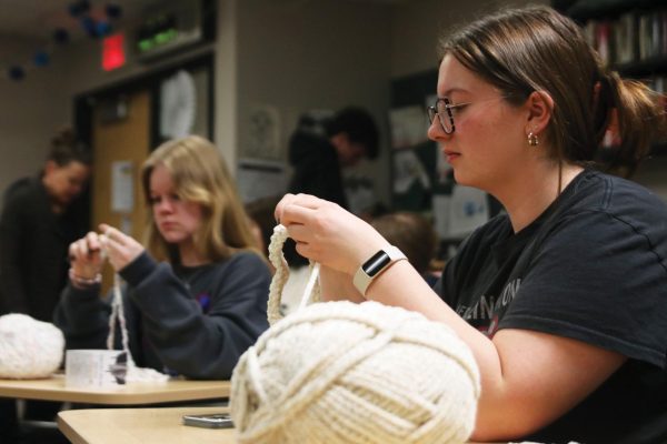 Yarn in hand sophomore Liberty Bouskill works on perfecting her double crochet chain.