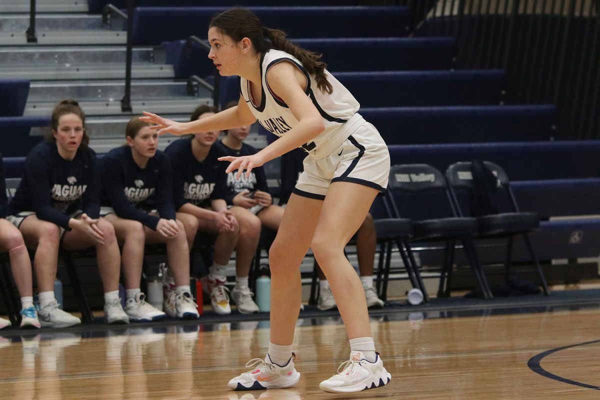 Getting ready for the next play, sophomore Paige Roth prepares to play defense.