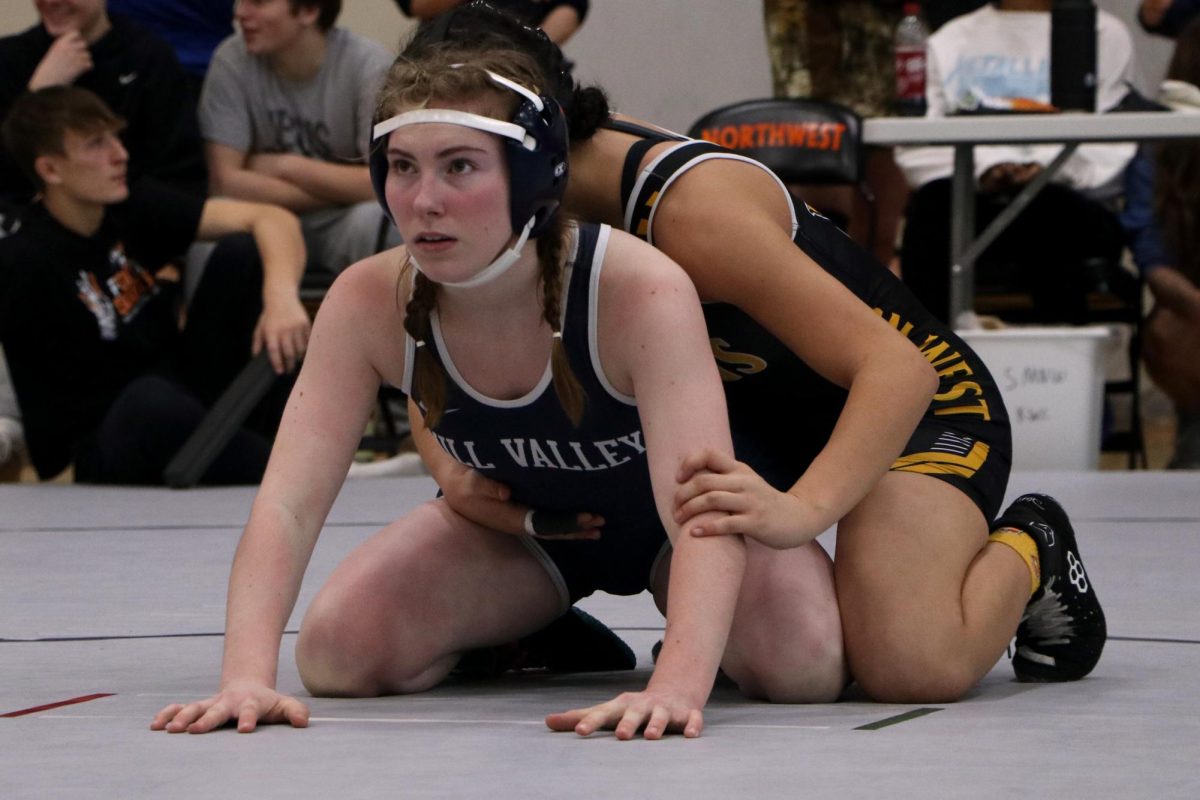 Focused, junior Piper Wendler gets in ready position for her match.