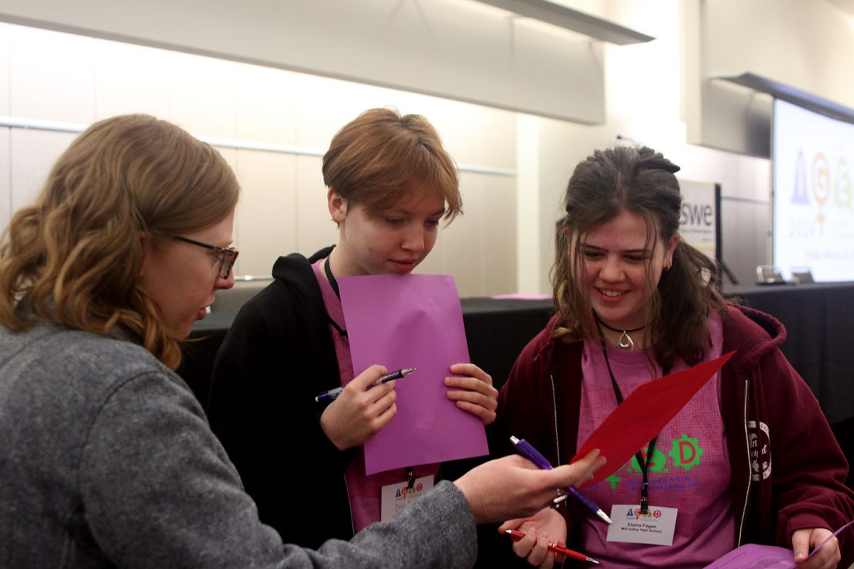 Juniors Cora Jones and Elaina Fagen participate in a meet and greet with the many women attending this years Introduce a Girl to Engineering Day (IGED).