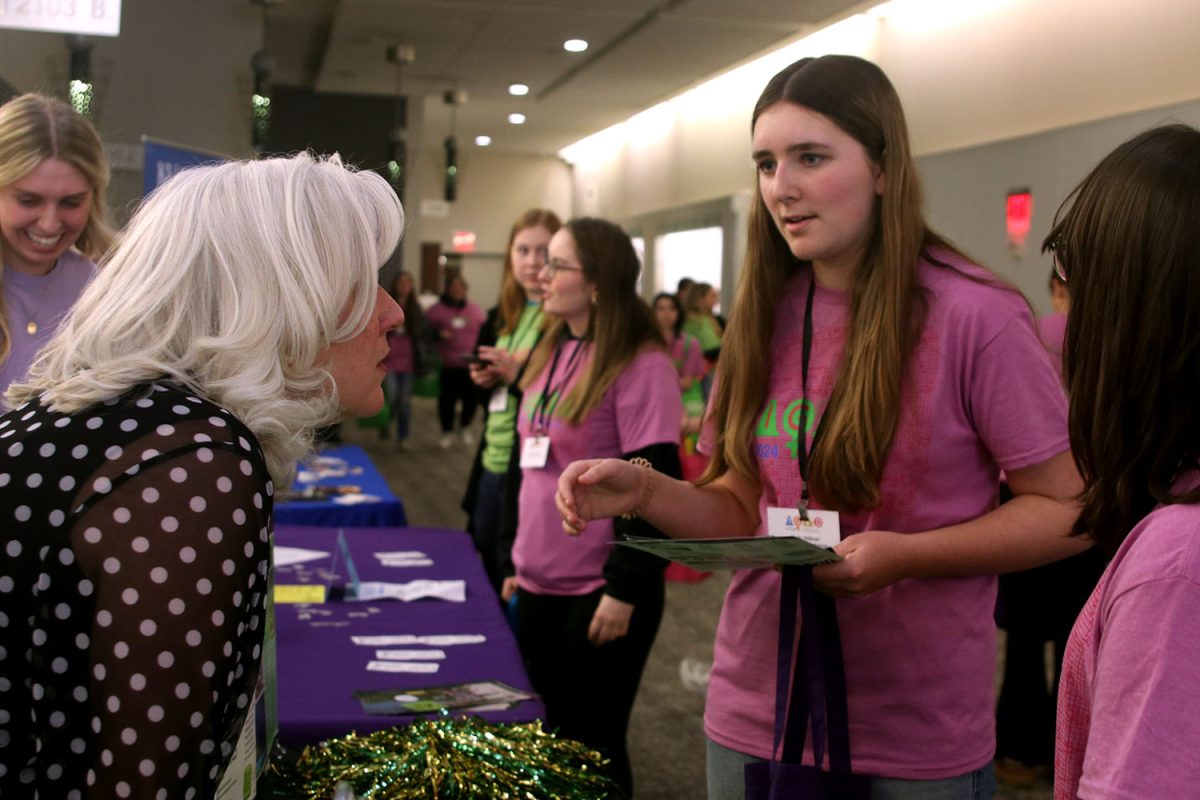 Freshman Molly Hillner discusses with a representative from Missouri S&T, a college with programs catered toward engineering students.