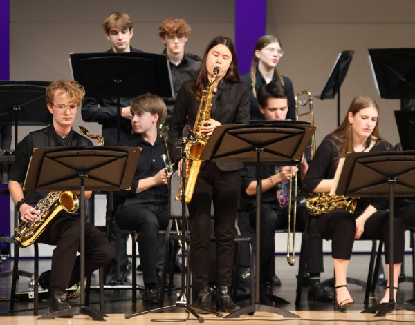 During the Jazz Bands performance junior Sophie Hsu plays her saxophone solo during “Jump” by Wynton Marsalis.