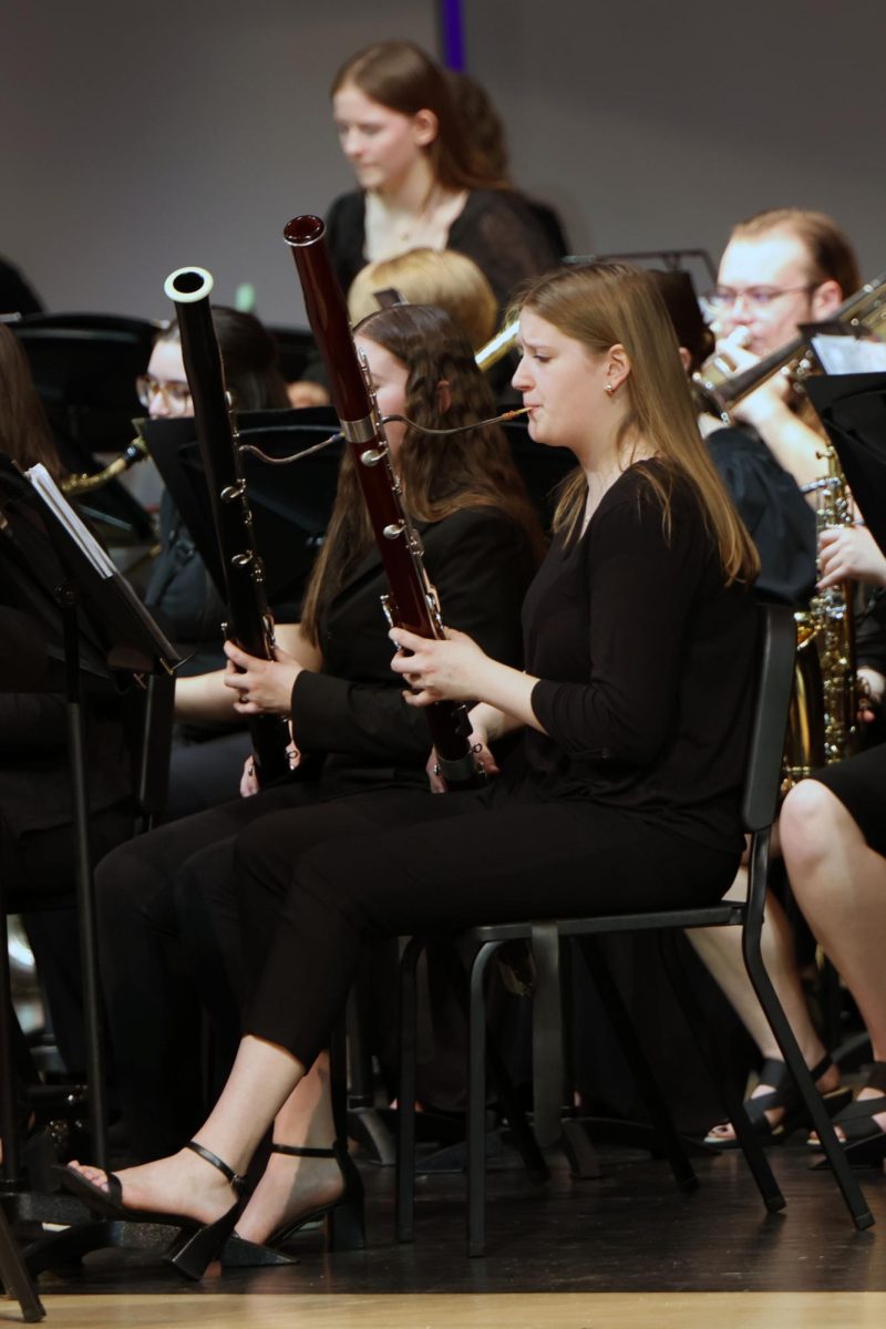 With her eyes on the music stand, senior Kate Marten plays the bassoon.