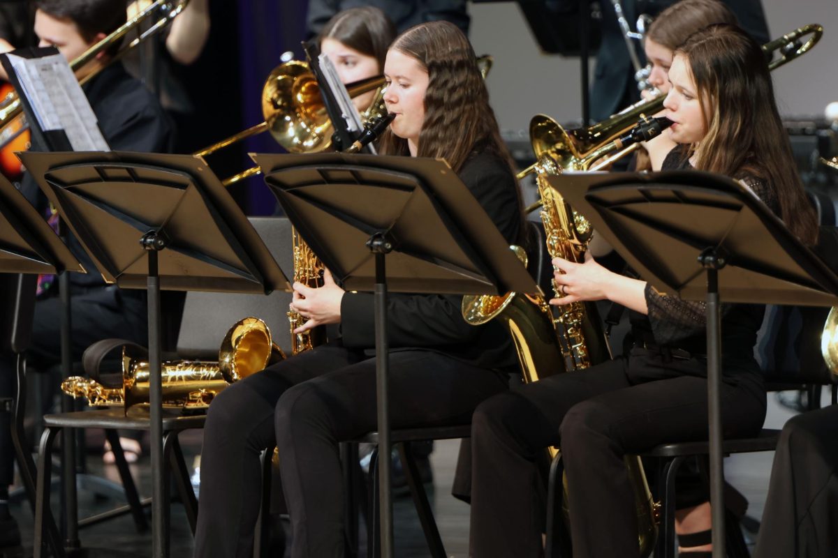 Focused, sophomore Jamie Boggs plays “Take 5” on the saxophone.