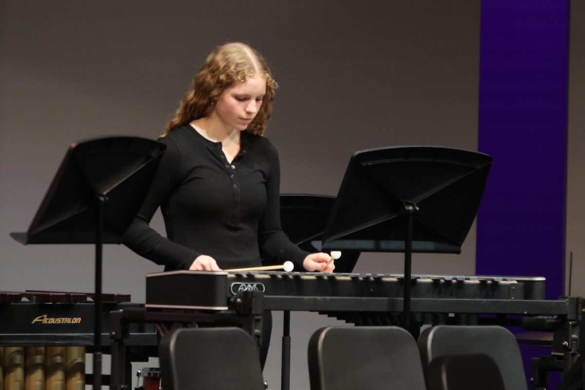 Mallets in hand, sophomore Abby Haney plays the Xylophone.