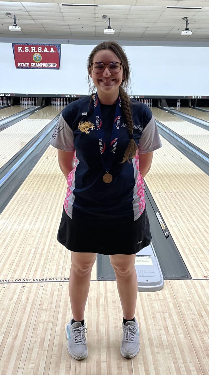 Smiling with her medal, senior Kiara Gonzalez places 11th at state