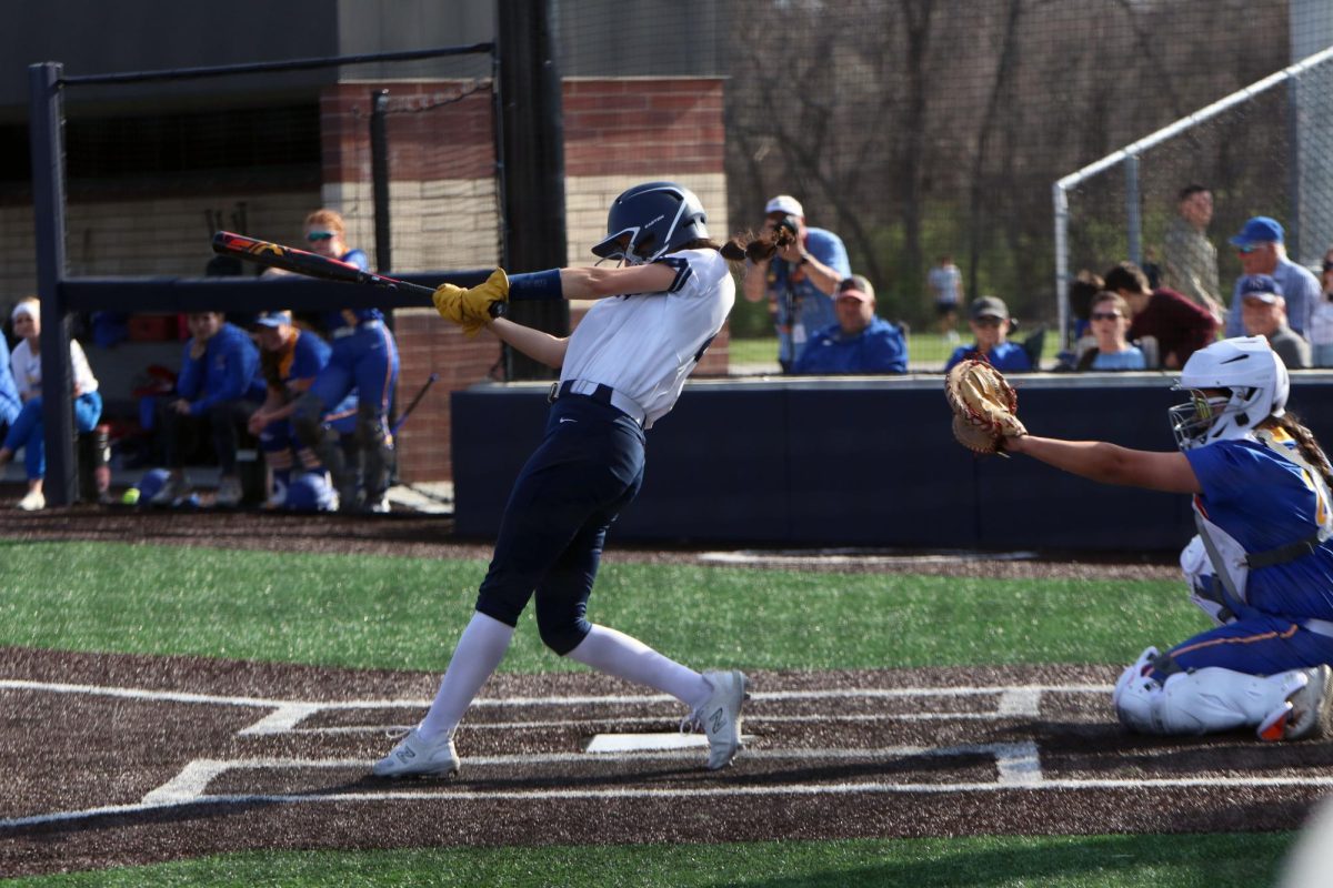 Junior Madi Lehr swings at the ball.