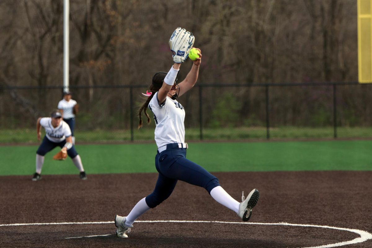 Sophomore Emma Hadley winds up to pitch the ball.