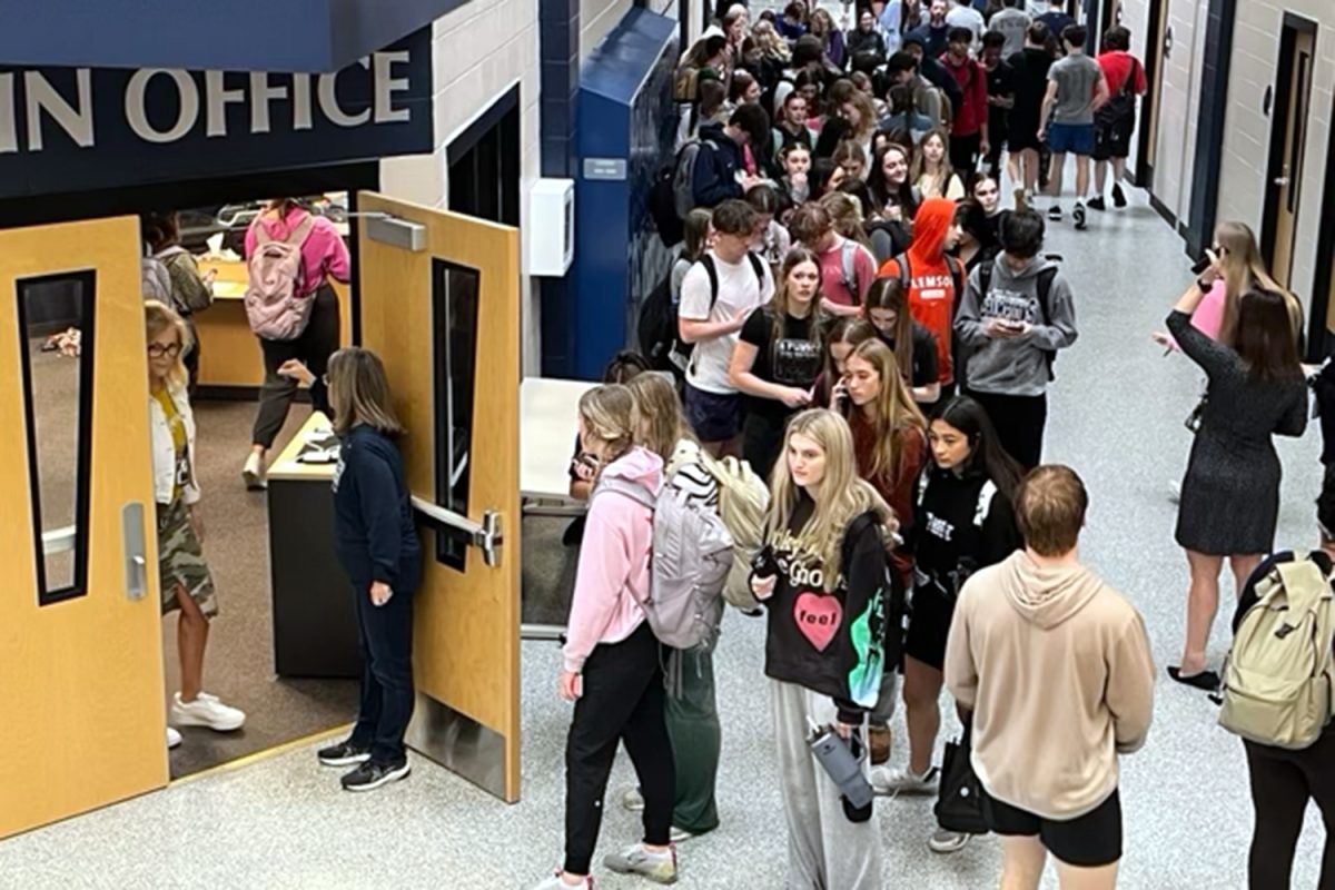 After returning to the school, students wait in line to be checked out at the office and go home. 
