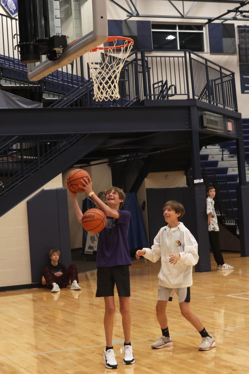 Freshmen Jackson Doll and Zach Spandet battle it out at the net during the knockout tournament. 