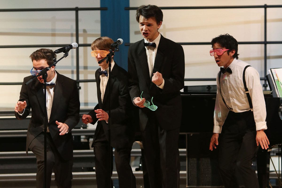 Singing together, senior AJ Lauer, sophomore Drew Cormany, and juniors Zane Lauer and Yazid Vazquez perform at the spring concert.