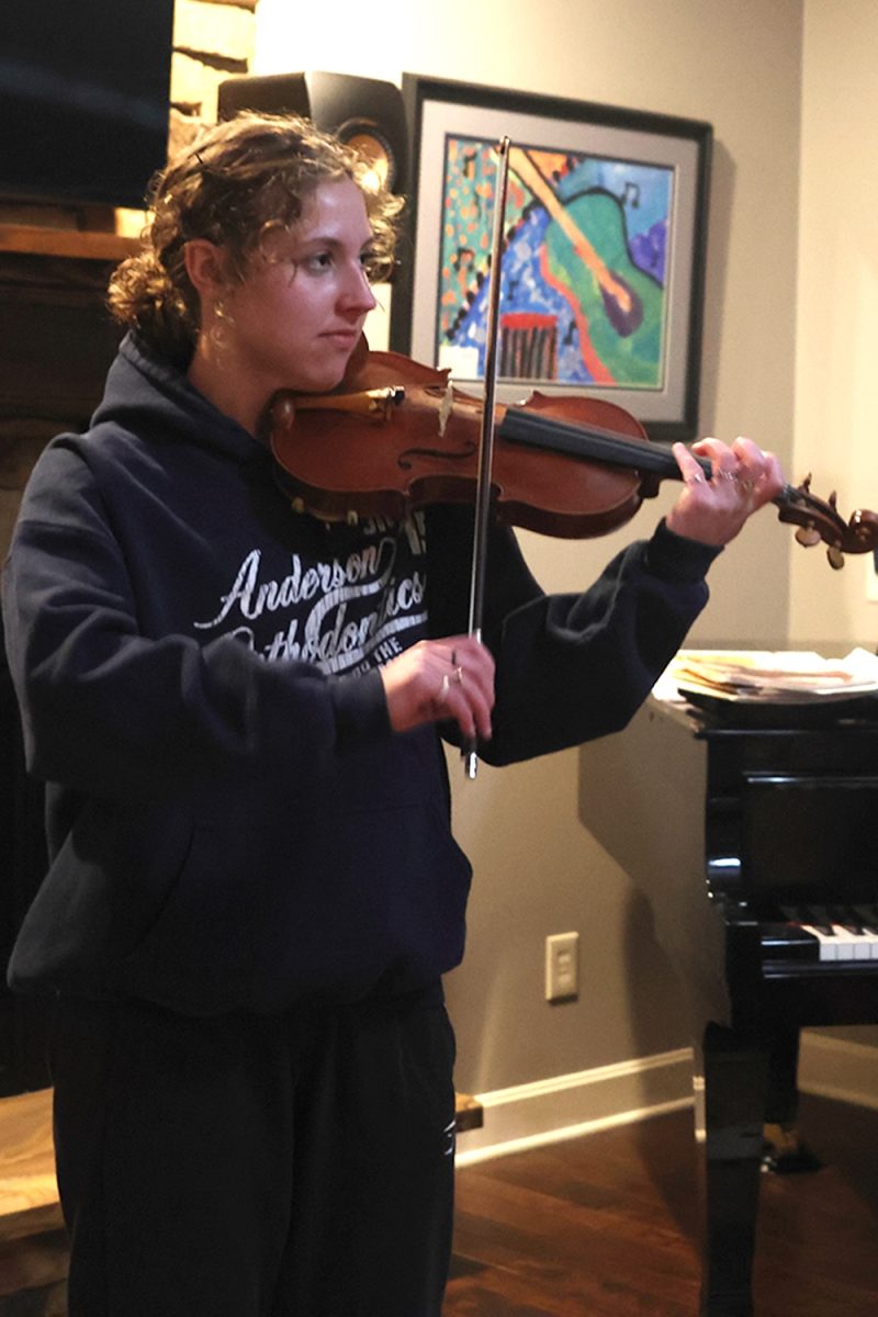 Expressing her love for music, senior Sarah Anderson plays a song that she has memorized Friday, March 1.
