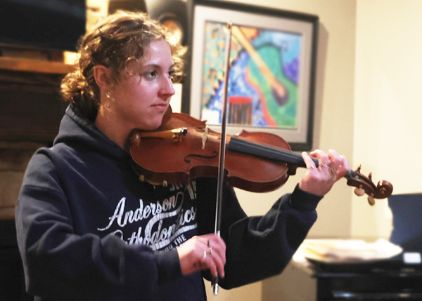 Expressing her love for music, senior Sarah Anderson plays a song that
she has memorized Friday, March 1.