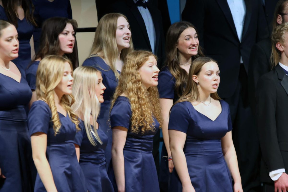 Senior Sarah Reynolds sings during "Zion's Walls" with Jag Chorale. 