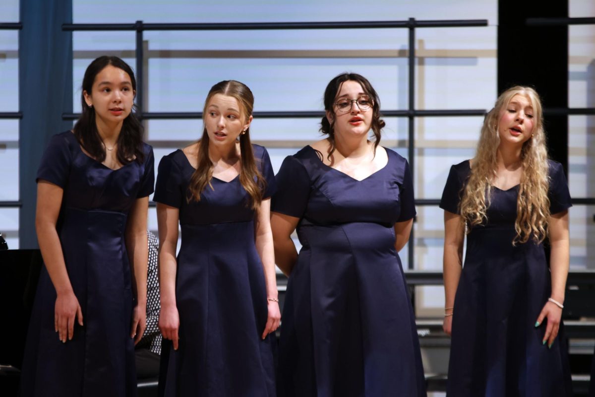 Singing with Jag Singers, seniors Peyton Aucoin, Grace Cormany, Guss Miller and Violet Hentges perform "Appletree".