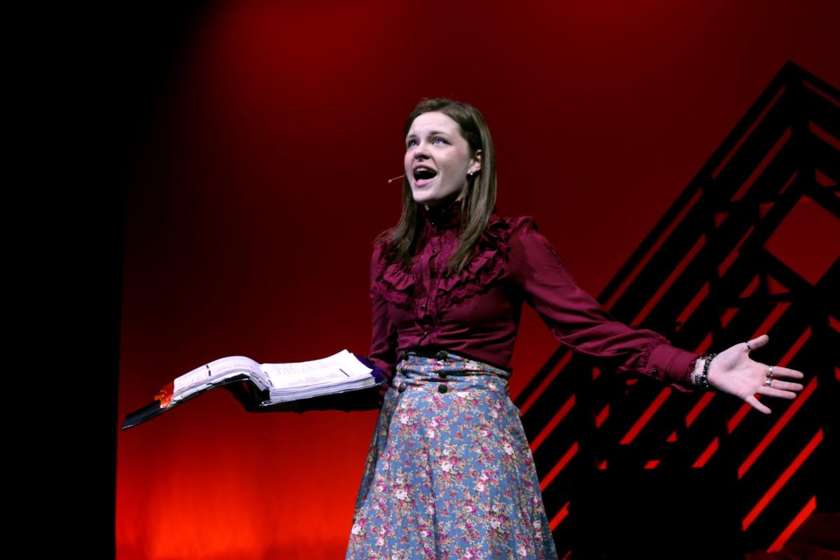 Senior Caroline Alley sings as her character, Jo March, finds her way through the trials of the plot.