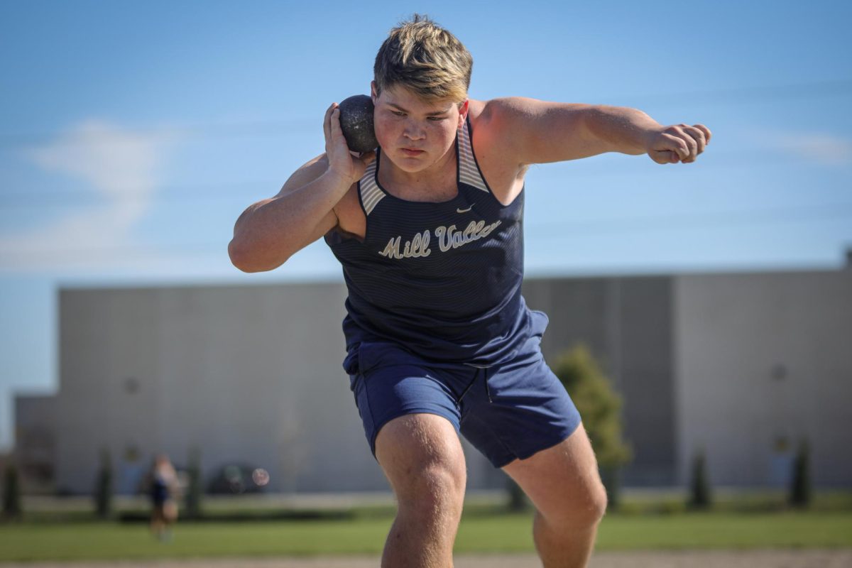 Before his throw, junior Eric Penner rears back to throw. 