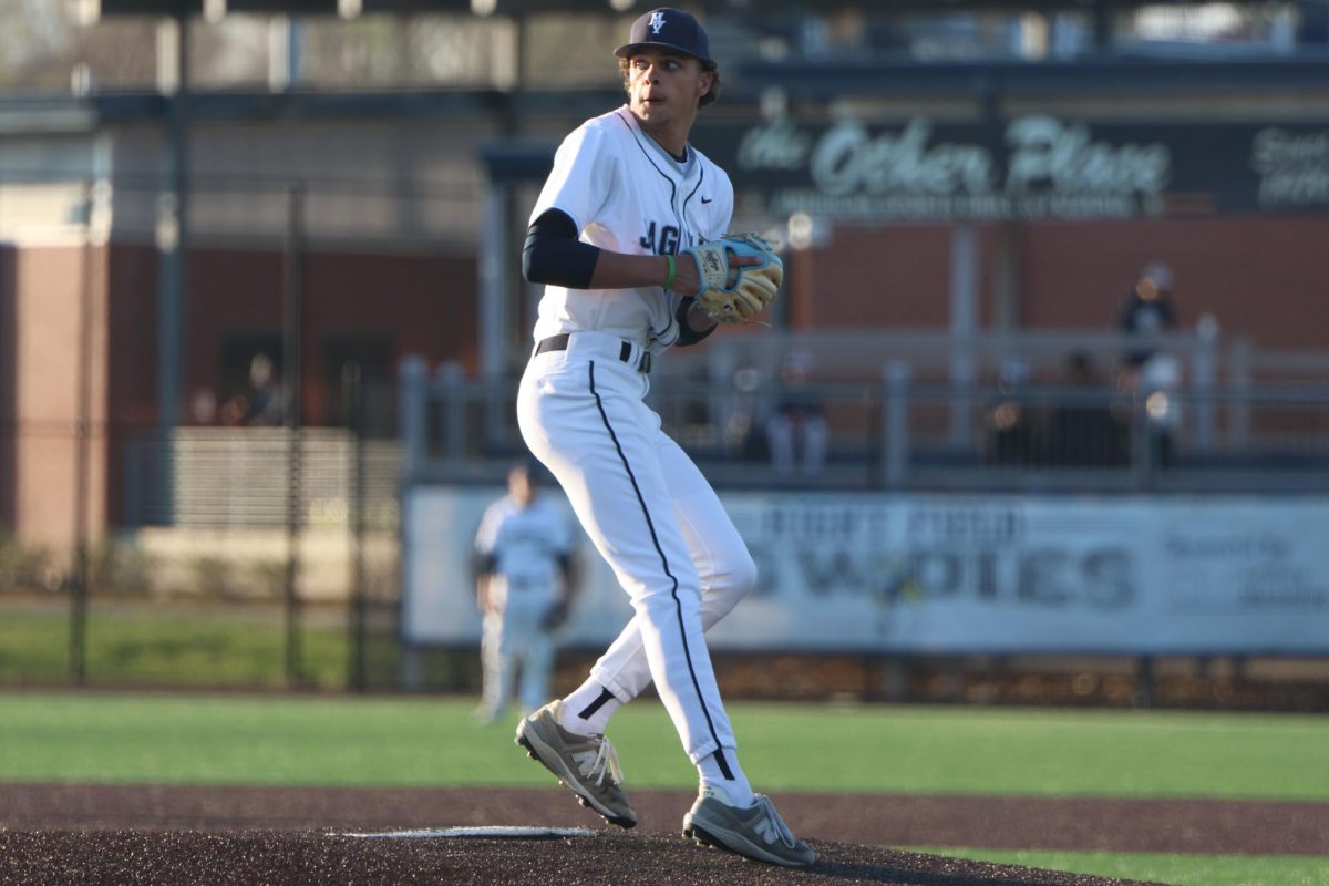 Junior Jake Hobbs performs a pickoff move to second base.