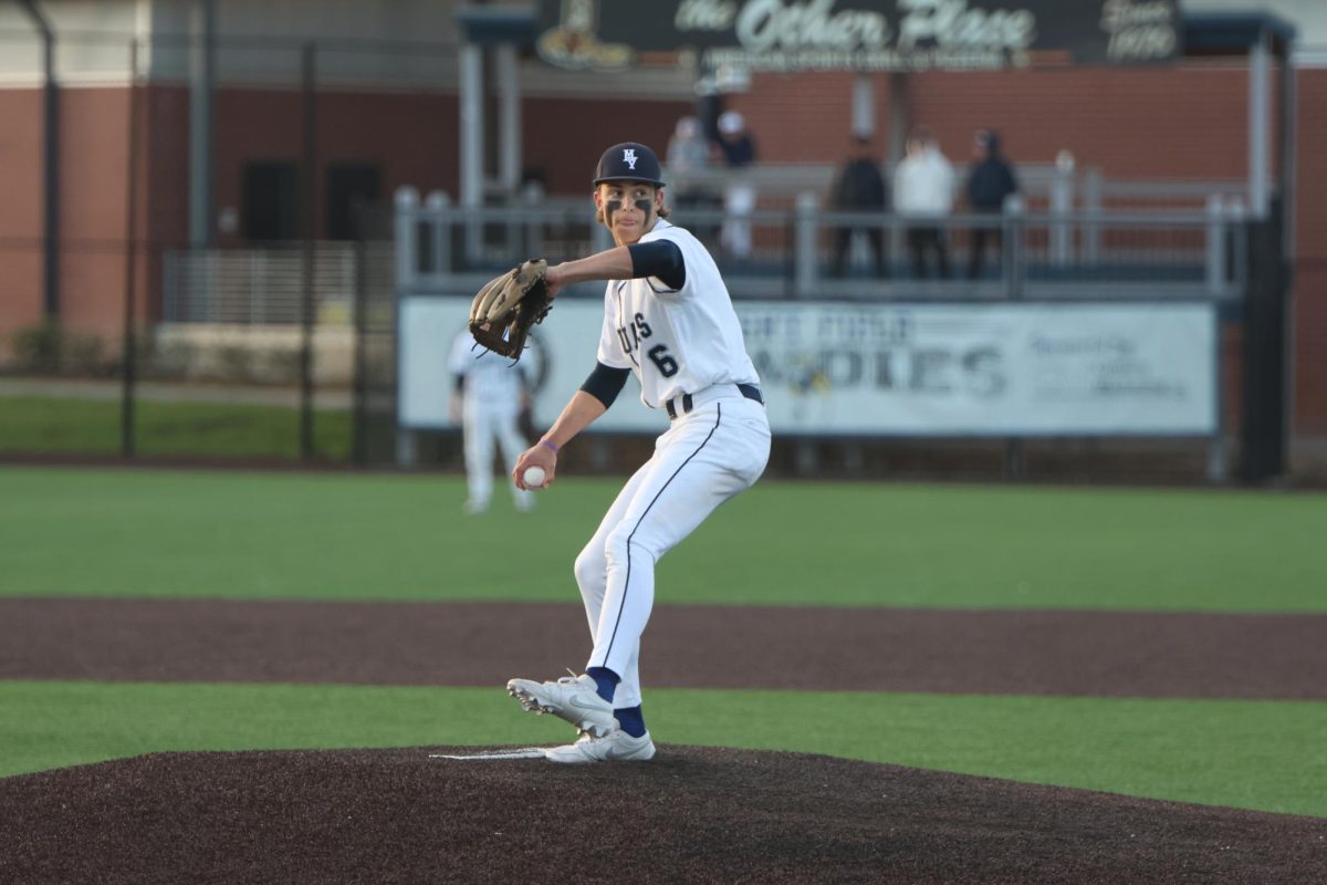 Coming in to close the game, sophomore Blake Jay delivers his first pitch. 