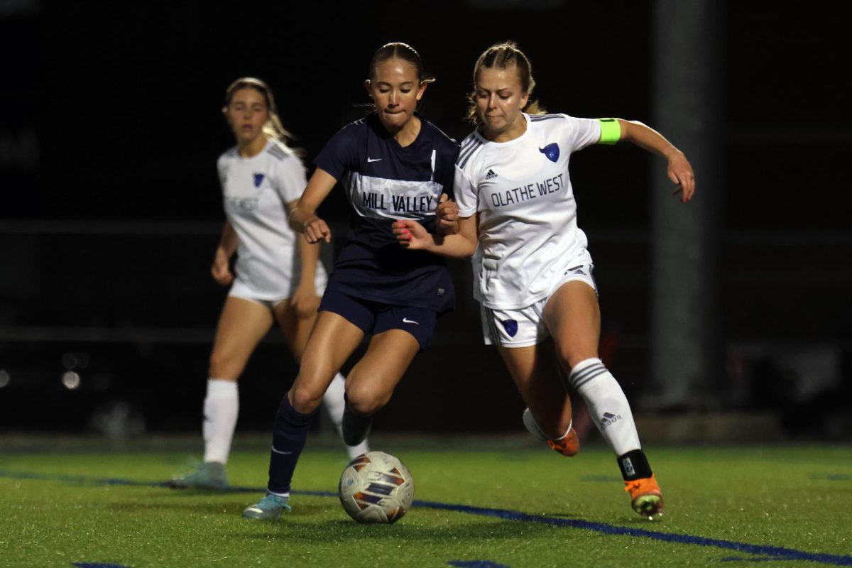 Competitively, freshman McKenna O’Neill keeps the ball away from her opponent.
