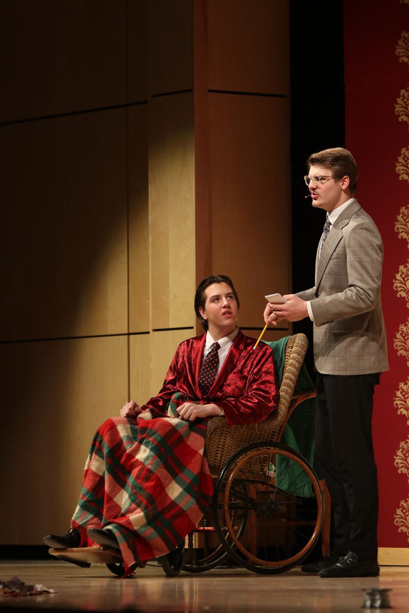Looking up, Mr. Whiteside, played by sophomore Barron Fox, listens as Bert Jefferson, played by senior Blake Powers, interviews him for his publication.