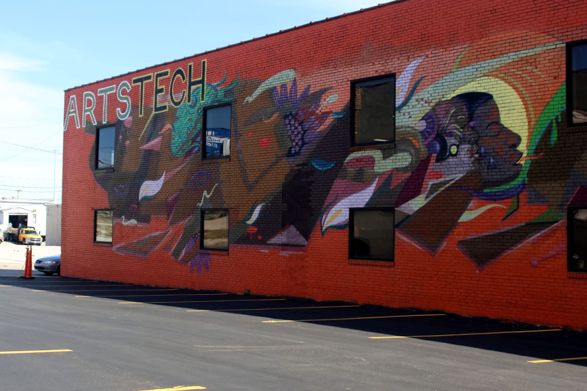A mural by artist Visual Goodies welcomes young adults into the Arts Tech building where they can gain skills from artistry to health.