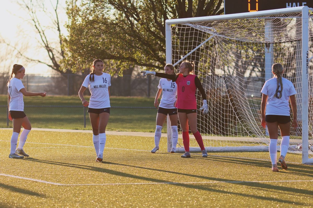 Yelling to her teammates, sophomore Jamie Ricker tells them where to go.