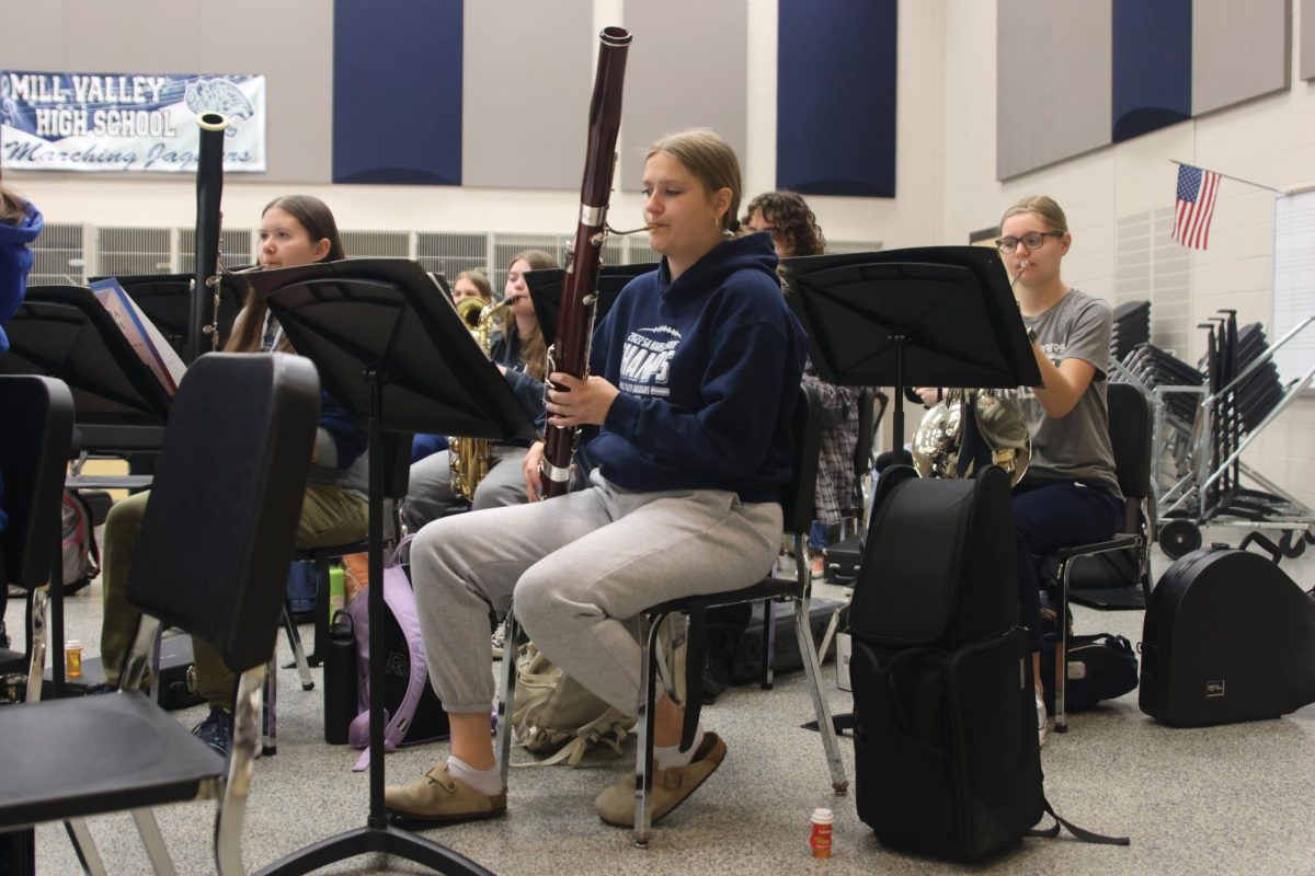 Prepping for band class, senior Kate Marten plays her warm ups on the bassoon. Marten played her bassoon at an in-person audition for the program.