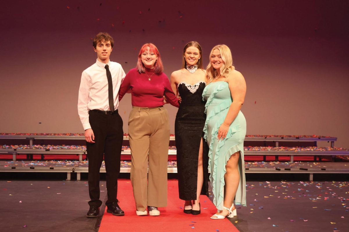 Seniors Nathan Anderson, Emma Clement, Caroline Alley and McKinley Graves stand at the Shooting Stars gala following their recognition Sunday, April 7.