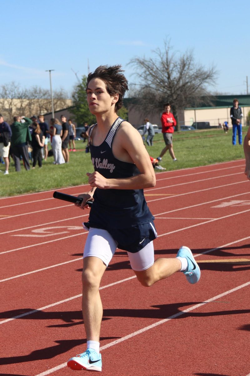 With his eyes up, sophomore Anderson Strack competes in the 4x800 meter relay.