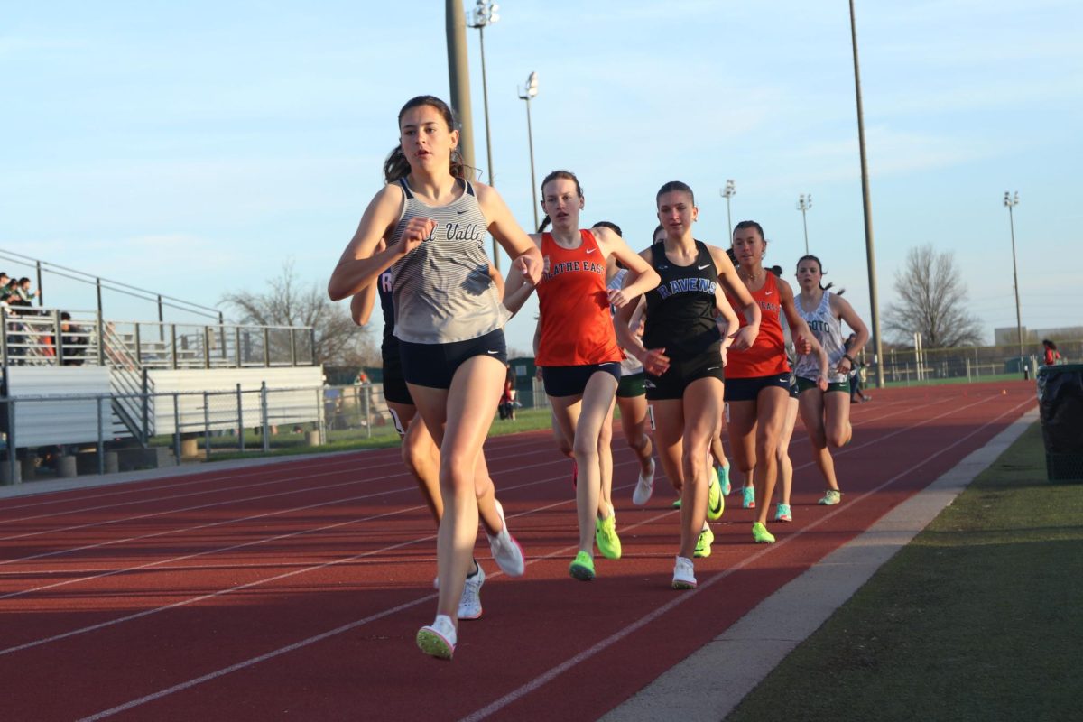 Leading the pack, sophomore Paige Roth finds her pace in the 800-meter race.