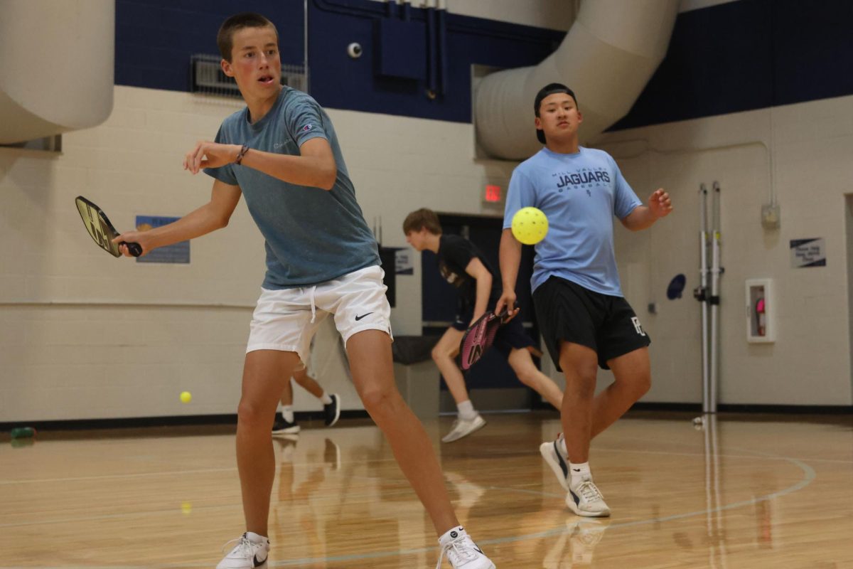 Paddle in hand, freshman Jace Hutchins prepares to strike the ball back at his opponent.