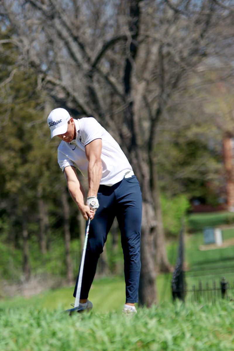 Mid swing, senior Broden Resch focuses on his drive.